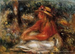 Jeune femme assise sur l'herbe