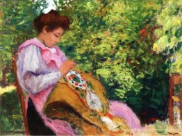 Fille broder, assise dans un jardin