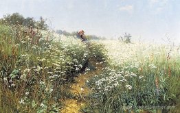 Une femme sous un parapluie sur une prairie à fleurs