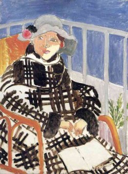 Mlle Matisse dans un manteau à carreaux écossais