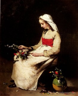 Une fille arrangeant un vase de fleurs