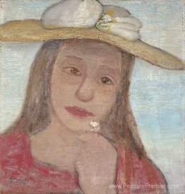 Jeune fille avec un chapeau de paille et une fleur à la main