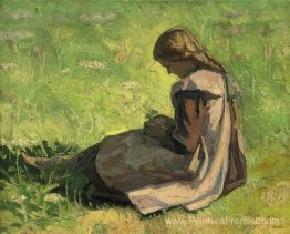 Fille assise dans l'herbe