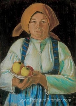 Jeune femme gardant des pommes